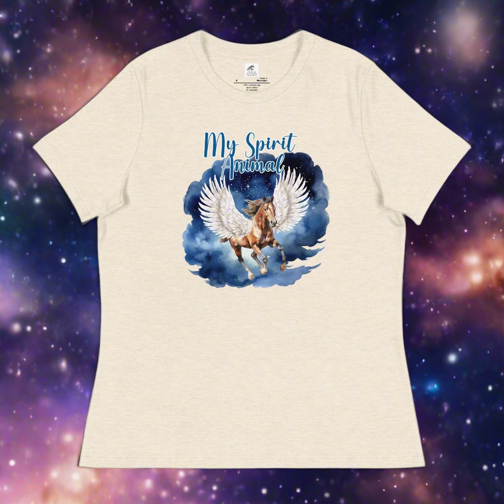 My Spirit Animal Women's Graphic Tee, Flat front view of heather prism natural tee, Pegasus white feathered wings on a Pinto with a dark brown mane and tail, galloping through the sky against a background of clouds and stars. Mythical Accessories