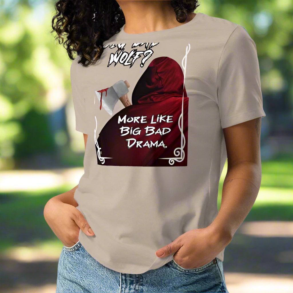 Heather stone Women's Graphic T-Shirt model front view. Big Bad Wolf Little Red Riding Hood. Big Bad Wolf? More Like Big Bad Drama. Back of Red Riding Hood with hood pulled up, bloodied axe over shoulder.