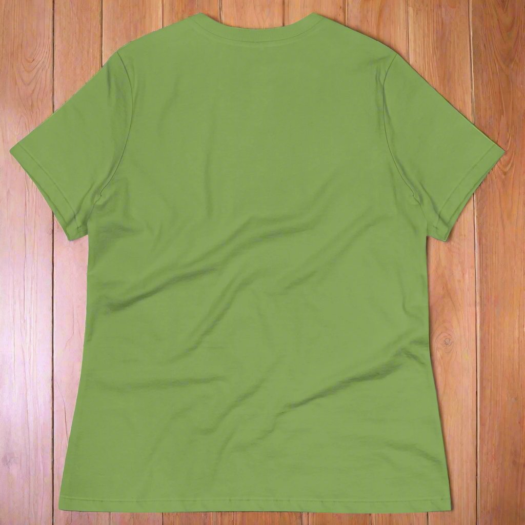 Leaf (green) back View Women's  T-Shirt on wooden surface. DND players gift for adventurers. Red Dragon, wings spread, stalking over a pile of D20 and other dice. RPG and Dungeons Masters