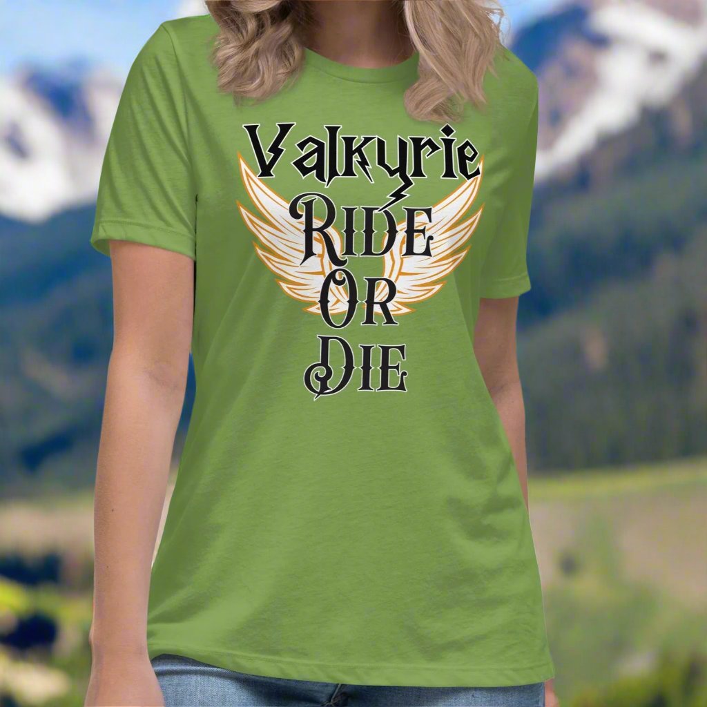 Women's Leaf (green) Front View T-Shirt. White Valkyrie wings edged in gold spread to both sides. Text on shirt Valkyrie Ride or Die.