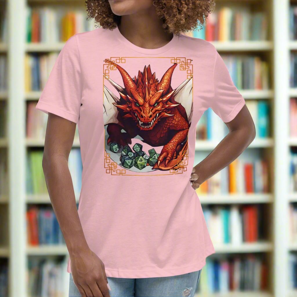 Pink Front View Women's  T-Shirt. DND players gift for adventurers. Red Dragon, wings spread, stalking over a pile of D20 and other dice. RPG and Dungeons Masters